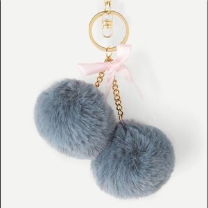 NWT gray Pom Pom clip on key chain.